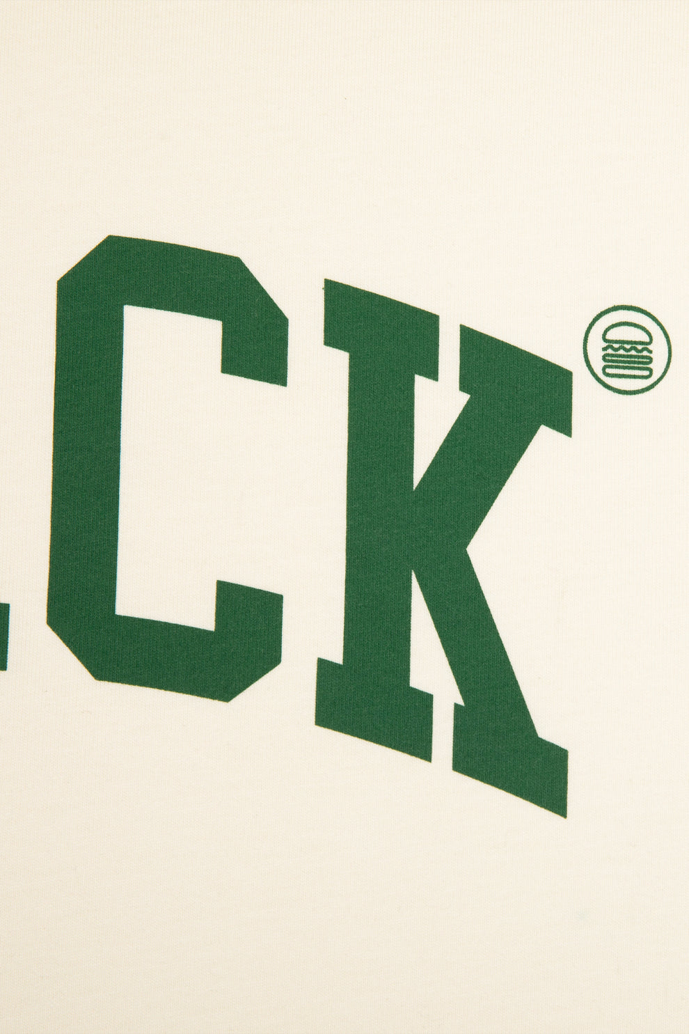 Closeup of the Shake Shack logo above the word "Shack"