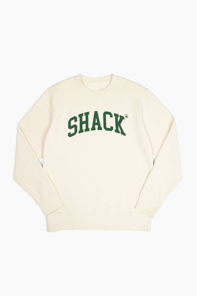 Cream-colored sweatshirt with the word "Shack" displayed across the chest