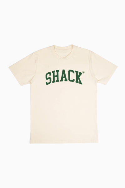 Cream-colored t-shirt with the word "Shack" displayed across the chest